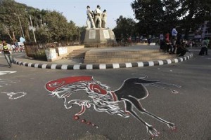 A cartoon of Bangladesh's Jamaat-e-Islami senior leader Abdul Quader Mollah is drawn on the street of university of Dhaka as students demand capital punishment for him, after a war crimes tribunal sentenced him to life imprisonment, in Dhaka February 6, 2013.